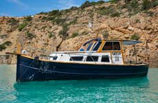 Giro in barca privata a Cala Bassa e isola Conejera
